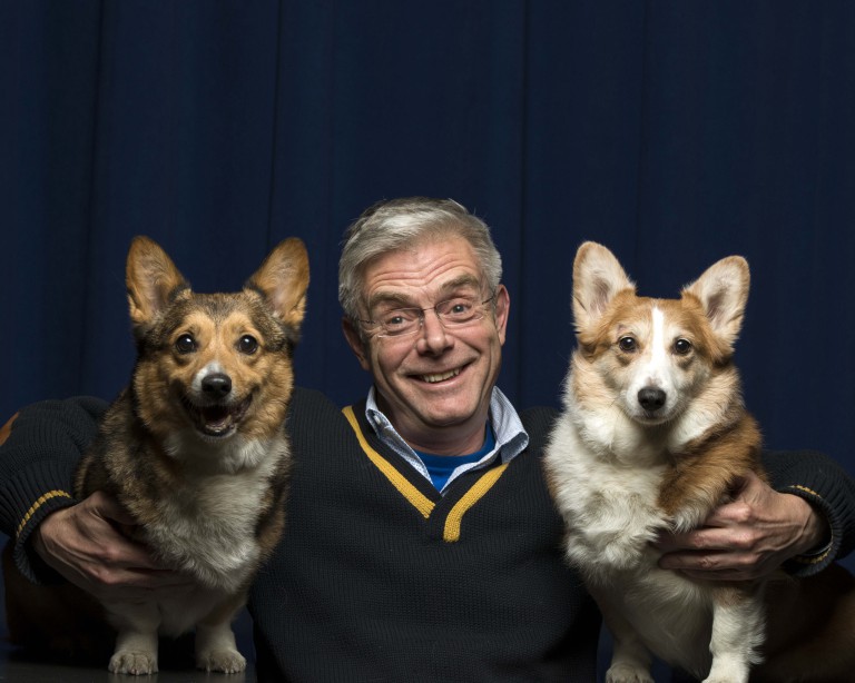 This Feb. 5, 2015 photo shows Tony Award-winning director Stephen Daldry posing for a portrait with a pair of Pembroke Welsh Corgis named Mimi and Marco in promotion of his "The Audience" at The New 42nd Street, in New York. (Photo by Drew Gurian/Invision/AP)